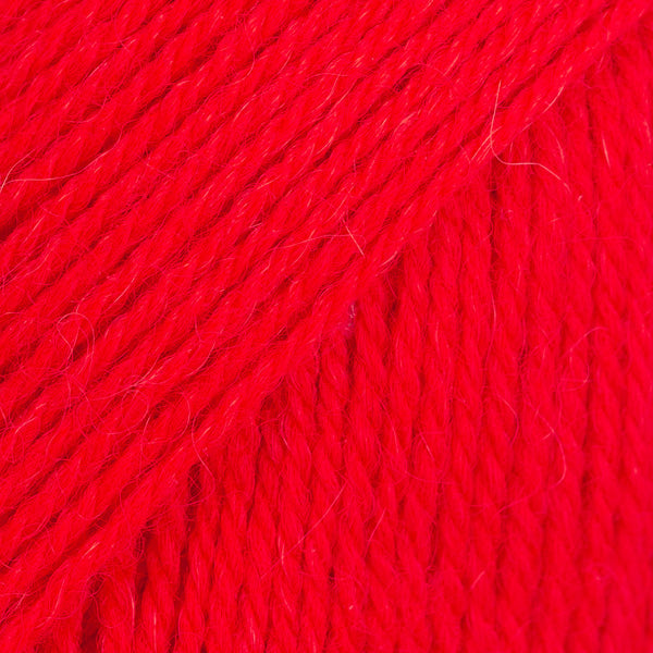 Close-up image of a soft yarn skein made from 65% wool and 35% alpaca wool, showcasing its smooth, luxurious texture. The yarn is a light, airy fiber perfect for knitting and crochet projects, with a rich sheen highlighting the natural beauty of alpaca wool. Ideal for creating warm, lightweight garments