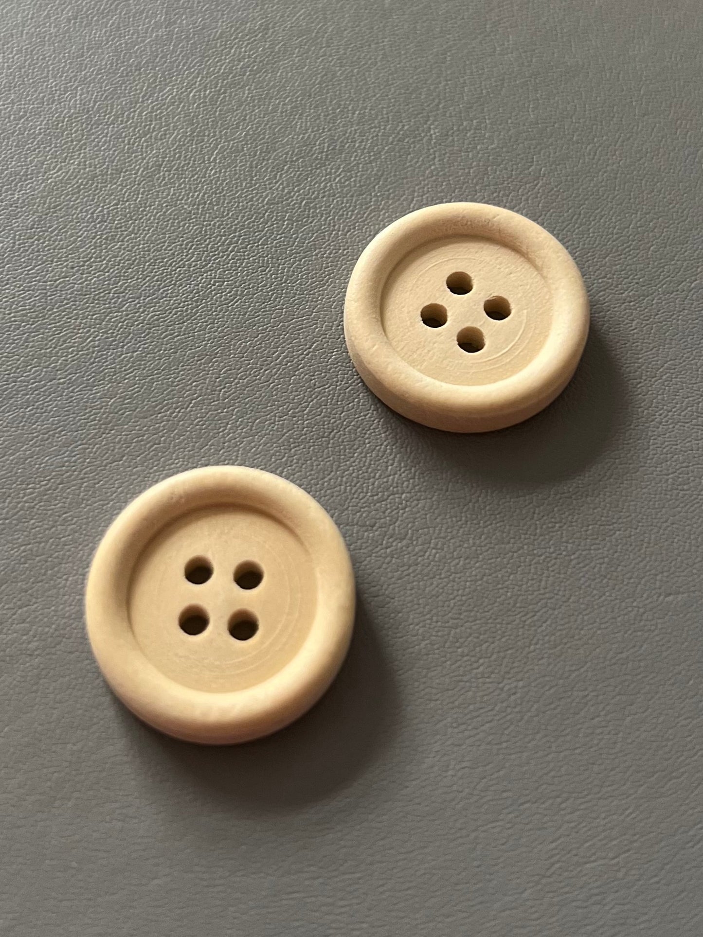 20mm red button made from wood with a painted finish. Available individually, this red button is perfect for both Christmas and everyday craft projects, alongside other colours like green, plaid, white, and raw wood