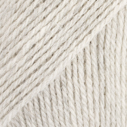 Close-up image of a soft yarn skein made from 65% wool and 35% alpaca wool, showcasing its smooth, luxurious texture. The yarn is a light, airy fiber perfect for knitting and crochet projects, with a rich sheen highlighting the natural beauty of alpaca wool. Ideal for creating warm, lightweight garments