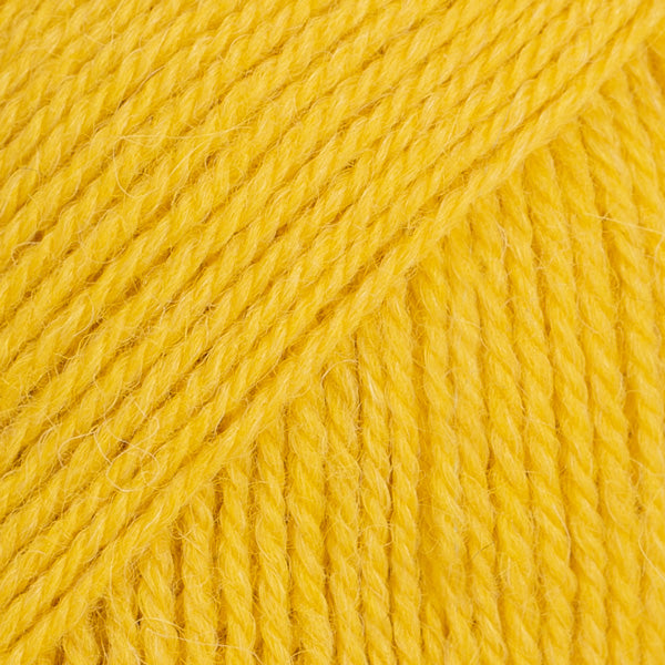 Close-up image of a soft yarn skein made from 65% wool and 35% alpaca wool, showcasing its smooth, luxurious texture. The yarn is a light, airy fiber perfect for knitting and crochet projects, with a rich sheen highlighting the natural beauty of alpaca wool. Ideal for creating warm, lightweight garments