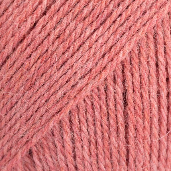 Close-up image of a soft yarn skein made from 65% wool and 35% alpaca wool, showcasing its smooth, luxurious texture. The yarn is a light, airy fiber perfect for knitting and crochet projects, with a rich sheen highlighting the natural beauty of alpaca wool. Ideal for creating warm, lightweight garments