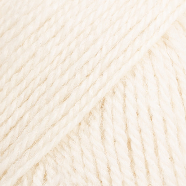 Close-up image of a soft yarn skein made from 65% wool and 35% alpaca wool, showcasing its smooth, luxurious texture. The yarn is a light, airy fiber perfect for knitting and crochet projects, with a rich sheen highlighting the natural beauty of alpaca wool. Ideal for creating warm, lightweight garments