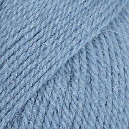 Close-up image of a soft yarn skein made from 65% wool and 35% alpaca wool, showcasing its smooth, luxurious texture. The yarn is a light, airy fiber perfect for knitting and crochet projects, with a rich sheen highlighting the natural beauty of alpaca wool. Ideal for creating warm, lightweight garments