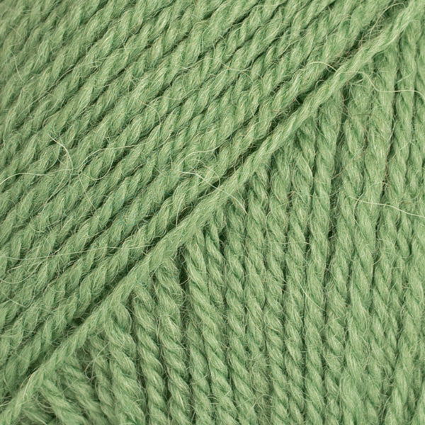 Close-up image of a soft yarn skein made from 65% wool and 35% alpaca wool, showcasing its smooth, luxurious texture. The yarn is a light, airy fiber perfect for knitting and crochet projects, with a rich sheen highlighting the natural beauty of alpaca wool. Ideal for creating warm, lightweight garments