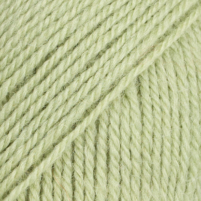 Close-up image of a soft yarn skein made from 65% wool and 35% alpaca wool, showcasing its smooth, luxurious texture. The yarn is a light, airy fiber perfect for knitting and crochet projects, with a rich sheen highlighting the natural beauty of alpaca wool. Ideal for creating warm, lightweight garments