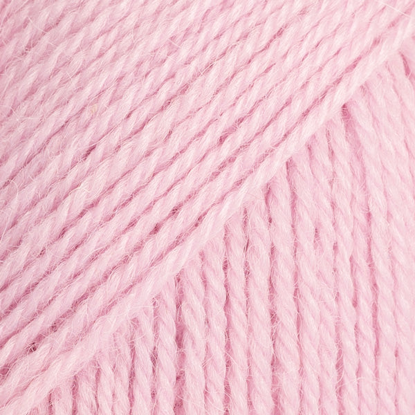 Close-up image of a soft yarn skein made from 65% wool and 35% alpaca wool, showcasing its smooth, luxurious texture. The yarn is a light, airy fiber perfect for knitting and crochet projects, with a rich sheen highlighting the natural beauty of alpaca wool. Ideal for creating warm, lightweight garments