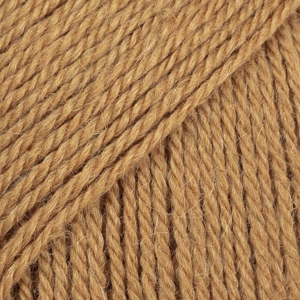 Close-up image of a soft yarn skein made from 65% wool and 35% alpaca wool, showcasing its smooth, luxurious texture. The yarn is a light, airy fiber perfect for knitting and crochet projects, with a rich sheen highlighting the natural beauty of alpaca wool. Ideal for creating warm, lightweight garments