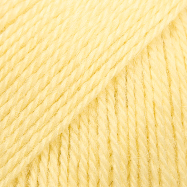 Close-up image of a soft yarn skein made from 65% wool and 35% alpaca wool, showcasing its smooth, luxurious texture. The yarn is a light, airy fiber perfect for knitting and crochet projects, with a rich sheen highlighting the natural beauty of alpaca wool. Ideal for creating warm, lightweight garments