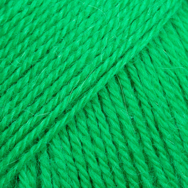 Close-up image of a soft yarn skein made from 65% wool and 35% alpaca wool, showcasing its smooth, luxurious texture. The yarn is a light, airy fiber perfect for knitting and crochet projects, with a rich sheen highlighting the natural beauty of alpaca wool. Ideal for creating warm, lightweight garments