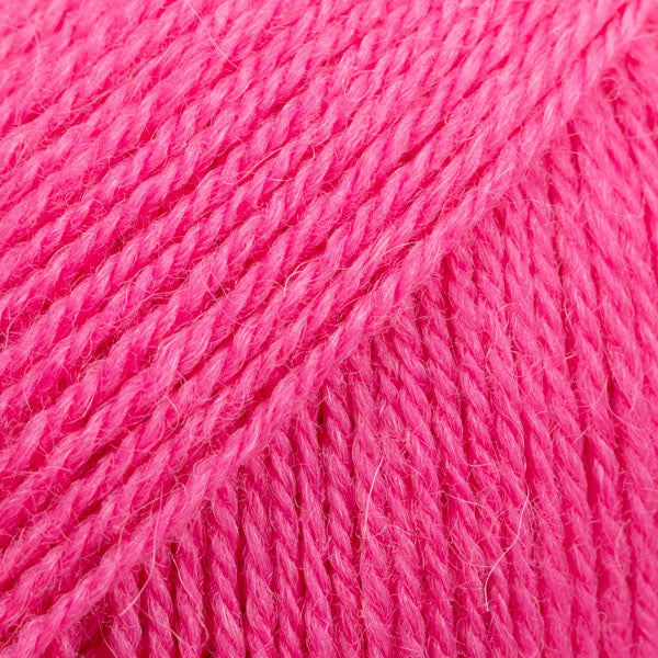 Close-up image of a soft yarn skein made from 65% wool and 35% alpaca wool, showcasing its smooth, luxurious texture. The yarn is a light, airy fiber perfect for knitting and crochet projects, with a rich sheen highlighting the natural beauty of alpaca wool. Ideal for creating warm, lightweight garments