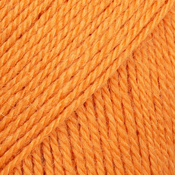 Close-up image of a soft yarn skein made from 65% wool and 35% alpaca wool, showcasing its smooth, luxurious texture. The yarn is a light, airy fiber perfect for knitting and crochet projects, with a rich sheen highlighting the natural beauty of alpaca wool. Ideal for creating warm, lightweight garments