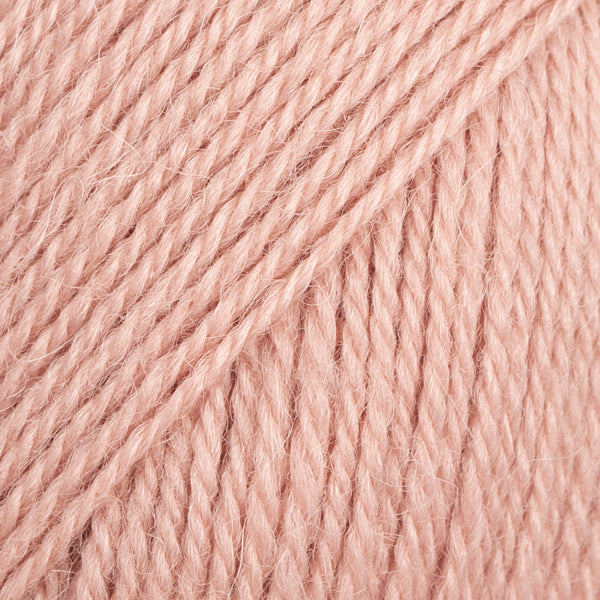 Close-up image of a soft yarn skein made from 65% wool and 35% alpaca wool, showcasing its smooth, luxurious texture. The yarn is a light, airy fiber perfect for knitting and crochet projects, with a rich sheen highlighting the natural beauty of alpaca wool. Ideal for creating warm, lightweight garments