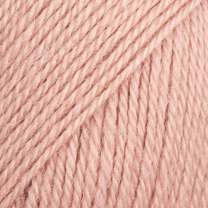 Close-up image of a soft yarn skein made from 65% wool and 35% alpaca wool, showcasing its smooth, luxurious texture. The yarn is a light, airy fiber perfect for knitting and crochet projects, with a rich sheen highlighting the natural beauty of alpaca wool. Ideal for creating warm, lightweight garments