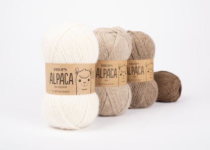 Skeins of DROPS Alpaca wool yarn in soft, natural alpaca wool with a smooth, slightly shiny texture