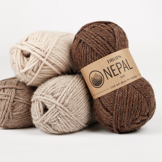 image of DROPS Nepal yarn, an aran wool blend made of 65% wool and 35% alpaca, showcasing its soft texture and natural colours. Perfect for cozy garments and accessories like sweaters, scarves, and hats