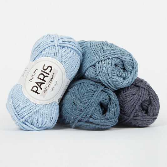 DROPS Paris 100% recycled cotton wool yarn in various denim shades, perfect for eco-friendly knitting and crochet projects